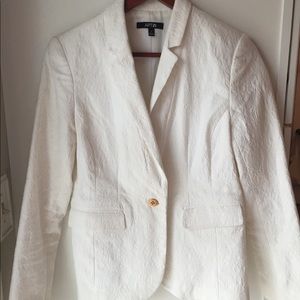 White blazer with paisley pattern.